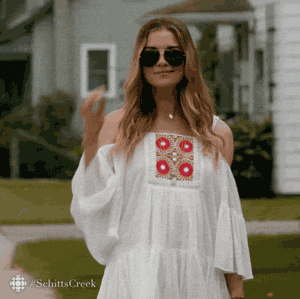 girl with sunglasses standing out