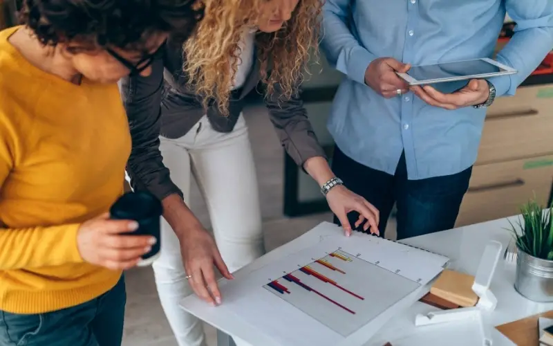 team looking over marketing results